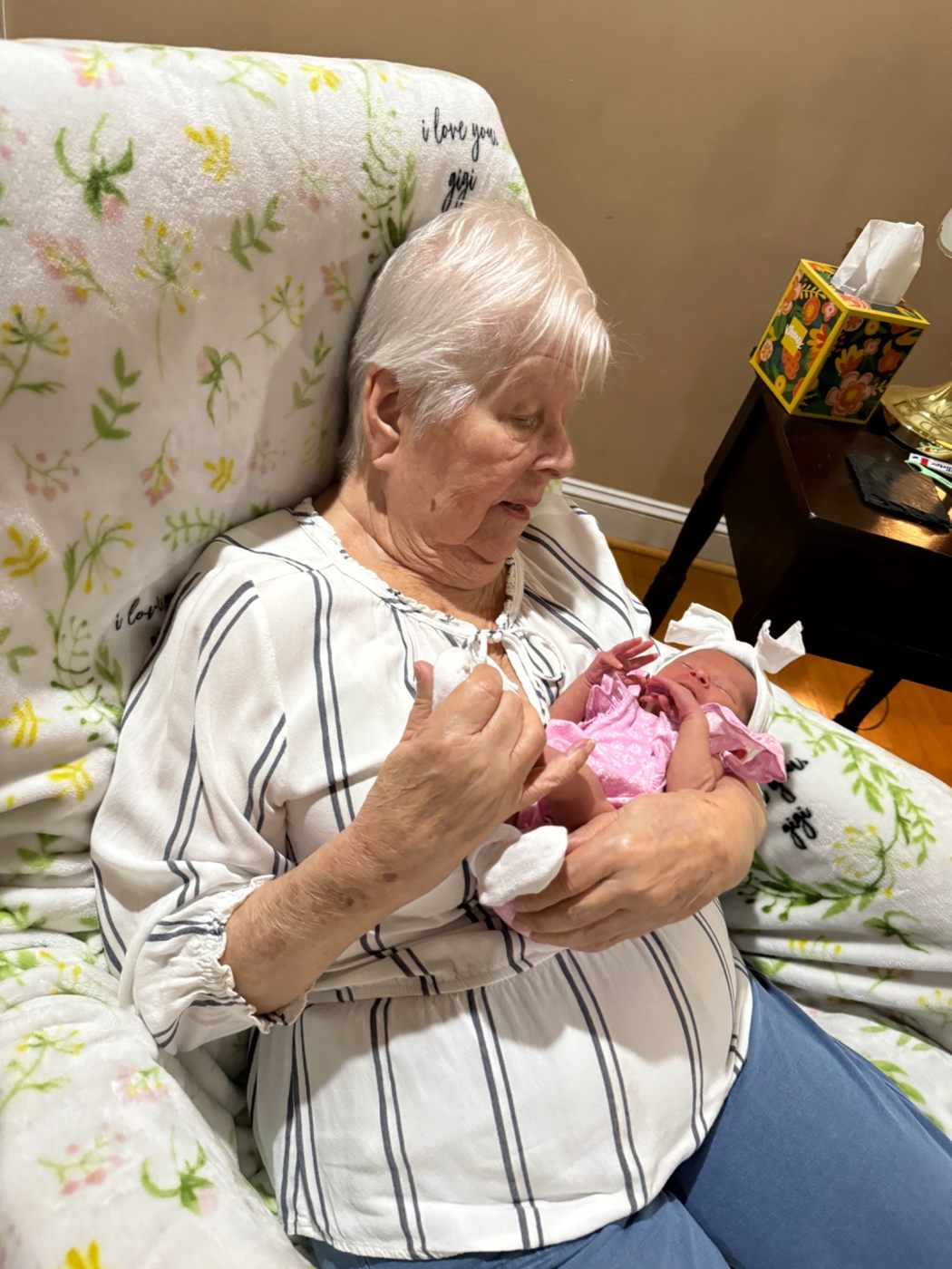 Jerilyn holding a newborn baby