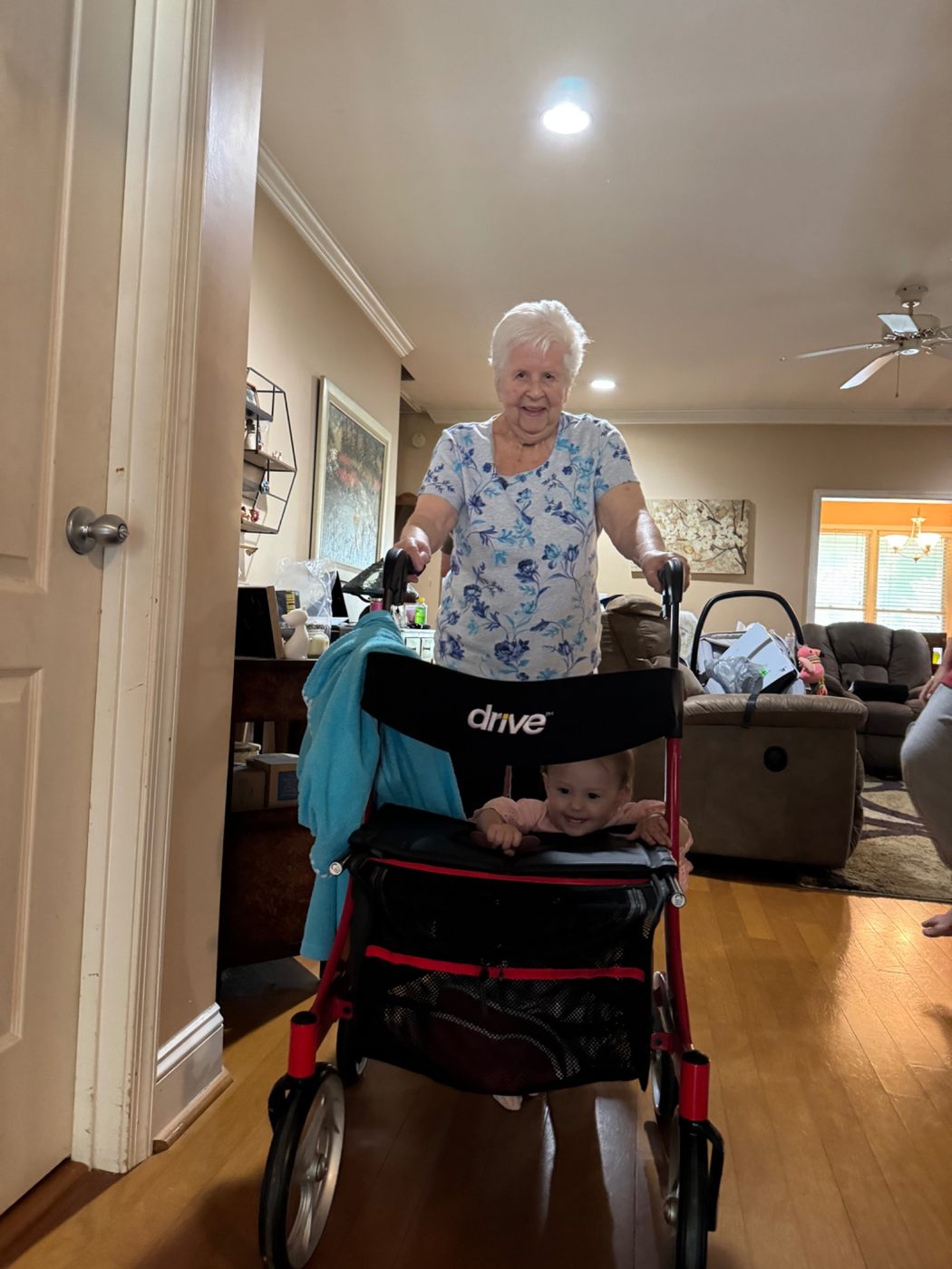 Jerilyn playfully walking with a young child