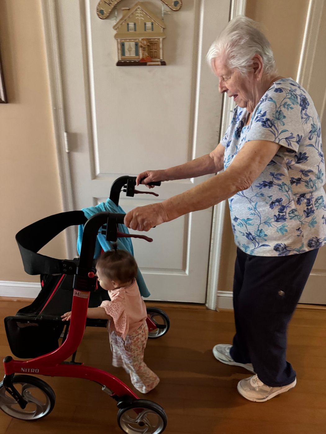 Jerilyn walking behind a young child